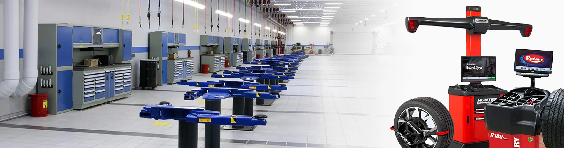 Hunter Alignment Systems 1 A Doehrman-provided wheel alignment machine from Hunter Engineering and a Rotary tire changer, situated in a garage with blue vehicle lifts lined up in the service area.